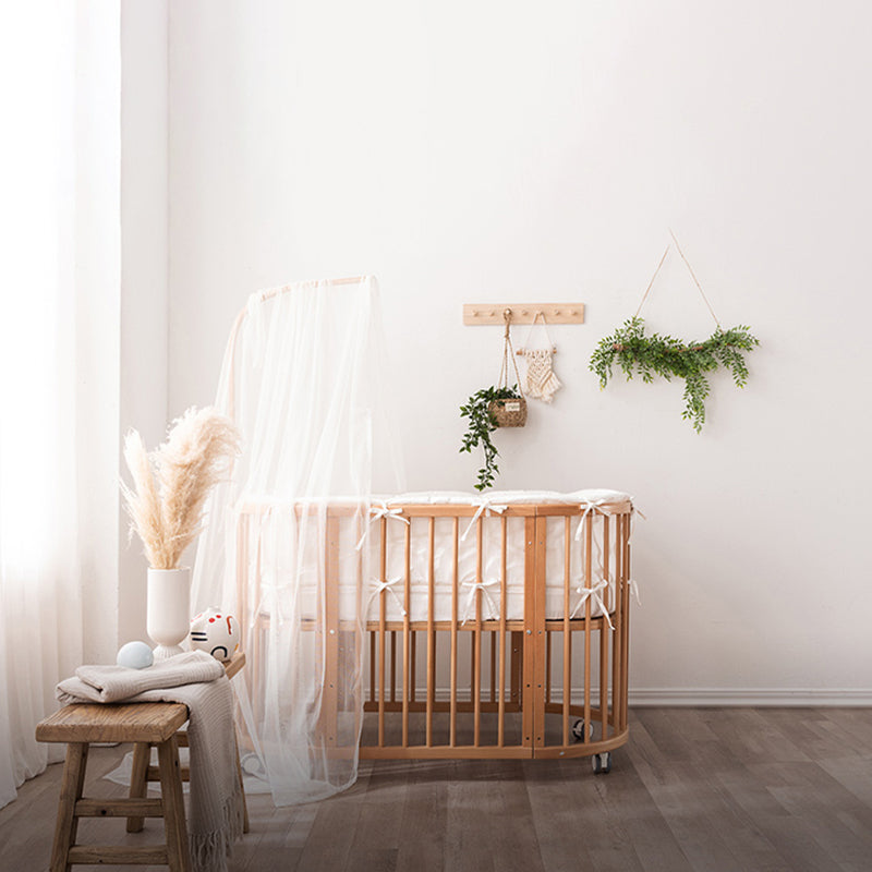 Oval Solid Wood Crib Nordic Style 5-In-1 Convertible Crib with Casters