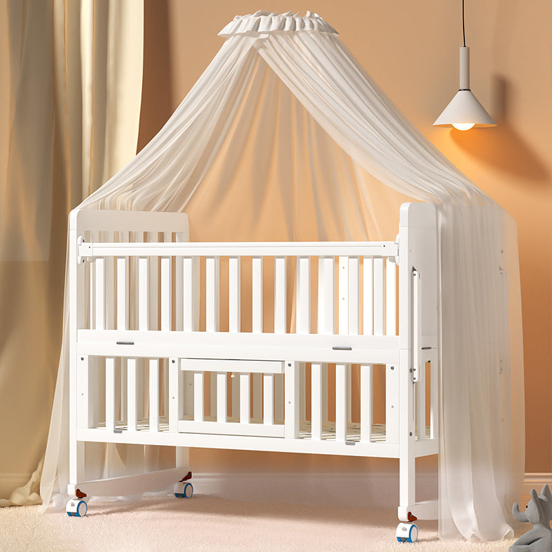 Scandinavian 2-in-1 Solid Wood Nursery Bed in White Wheels and Storage