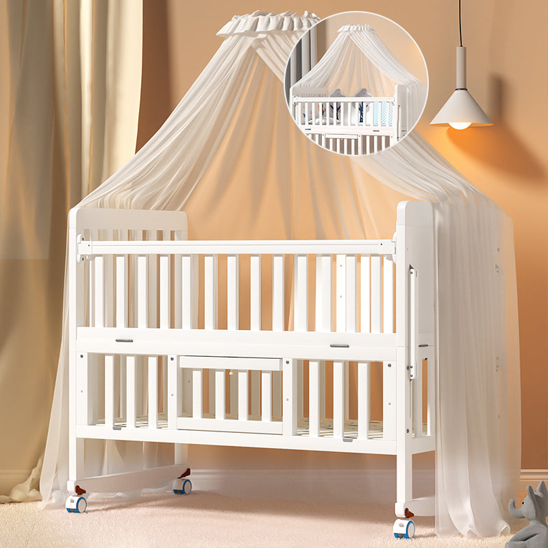 Scandinavian 2-in-1 Solid Wood Nursery Bed in White Wheels and Storage