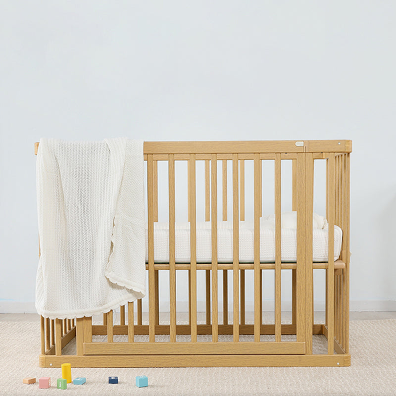 Contemporary 25.19" Wide Wooden Nursery Bed in Natural with Wheels