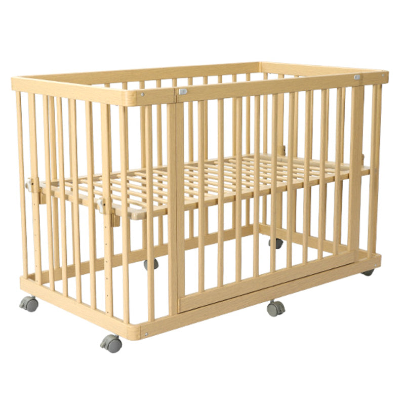 Contemporary 25.19" Wide Wooden Nursery Bed in Natural with Wheels