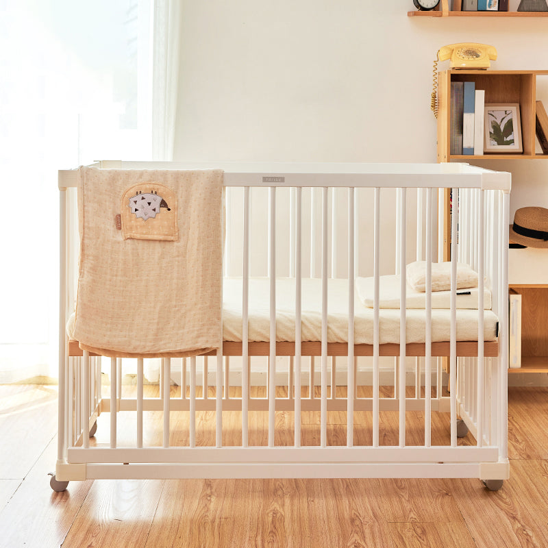 Scandinavian Crib with Guardrail White Wood with Casters/Wheels Nursery Crib