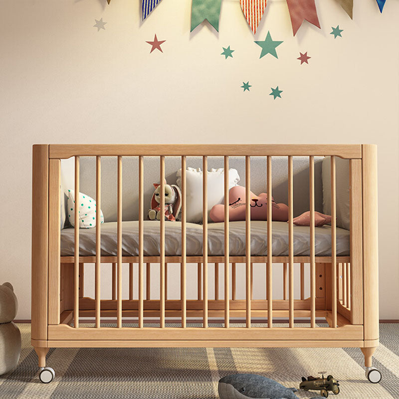 Contemporary Nursery Crib with Adjustable Height and Casters in Beech