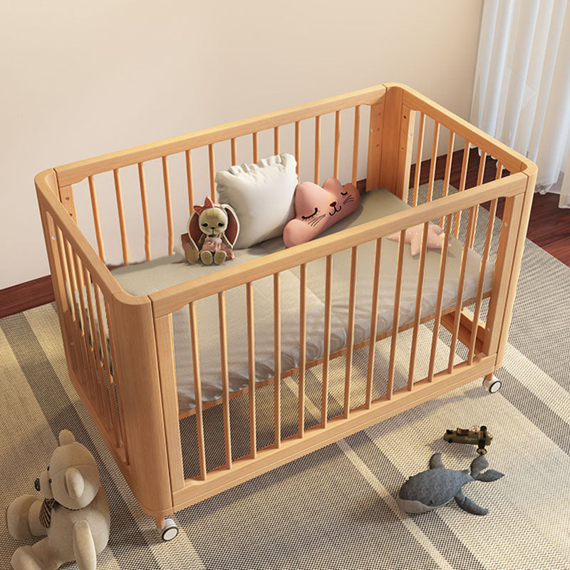 Contemporary Nursery Crib with Adjustable Height and Casters in Beech