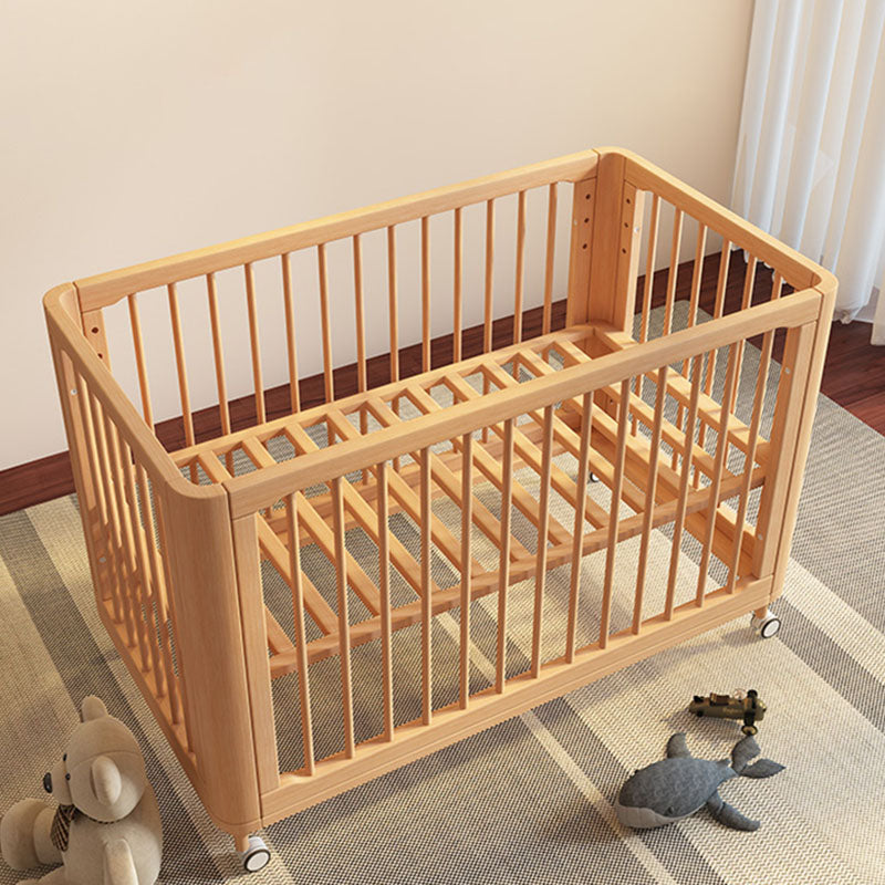 Contemporary Nursery Crib with Adjustable Height and Casters in Beech