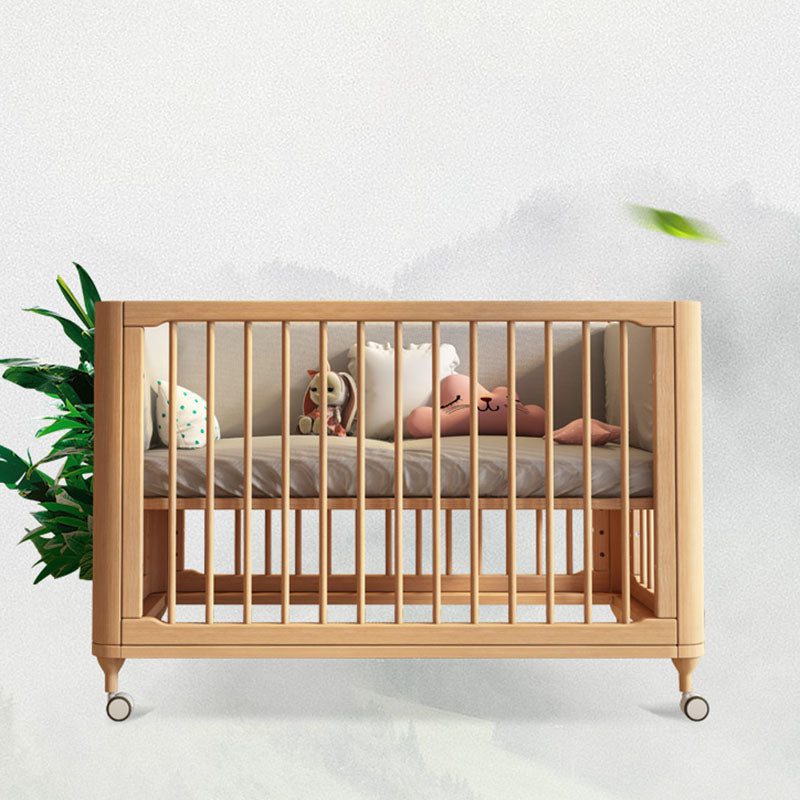 Contemporary Nursery Crib with Adjustable Height and Casters in Beech