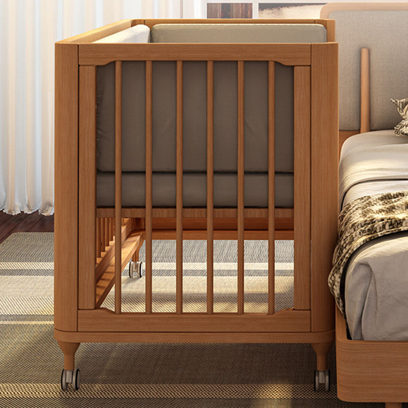 Contemporary Nursery Crib with Adjustable Height and Casters in Beech