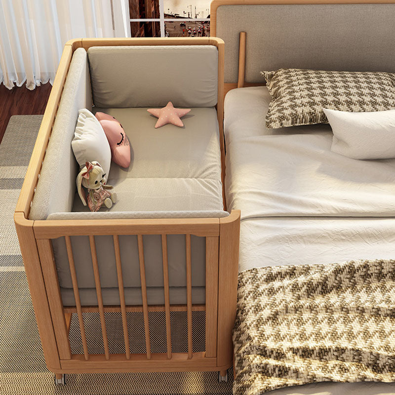 Contemporary Nursery Crib with Adjustable Height and Casters in Beech