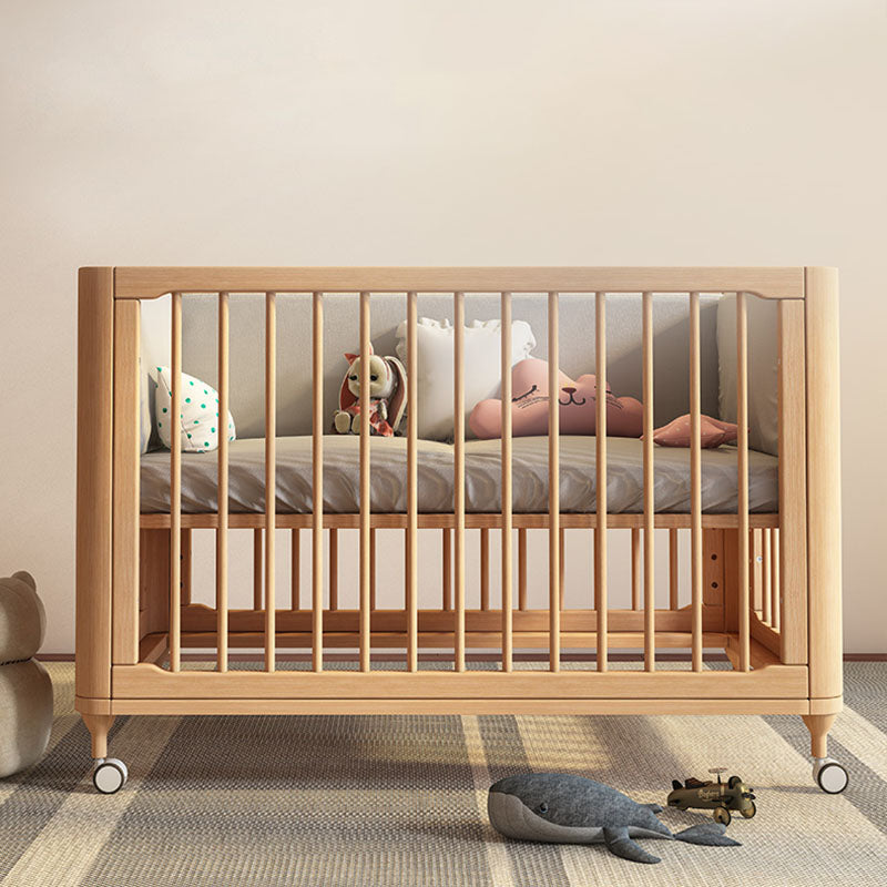 Contemporary Nursery Crib with Adjustable Height and Casters in Beech