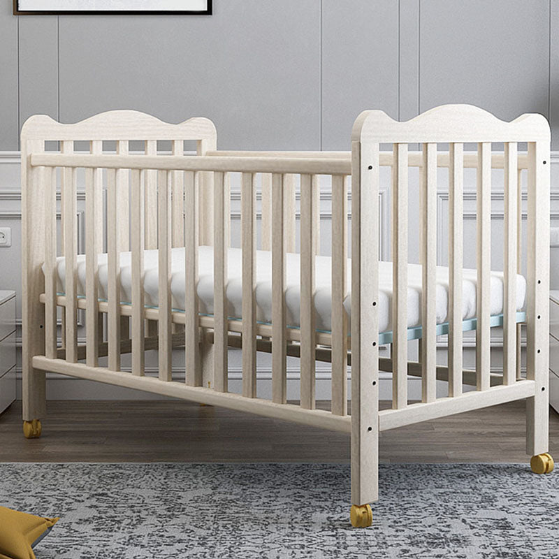 Farmhouse Wooden Baby Crib with Guardrail and Casters in Pine Wood