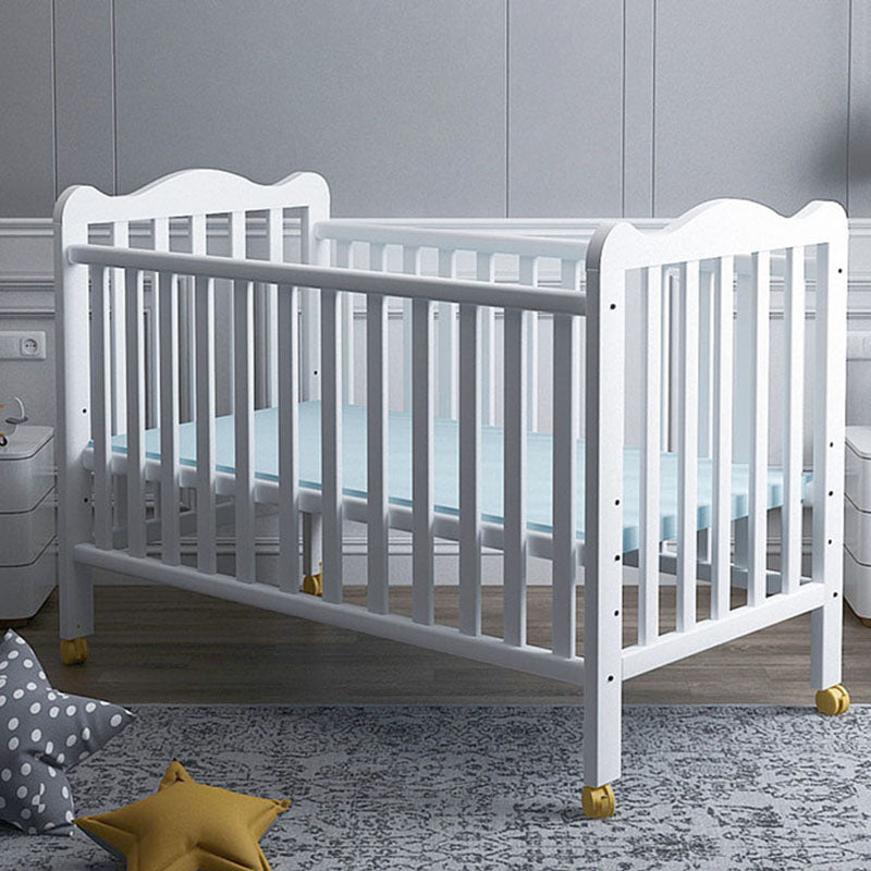 Farmhouse Wooden Baby Crib with Guardrail and Casters in Pine Wood