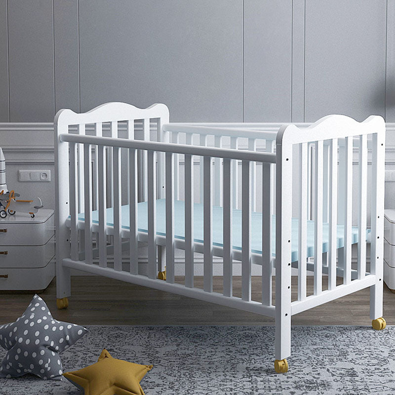 Scandinavian Wood Baby Crib Pine with Guardrail Nursery Crib with Wheels