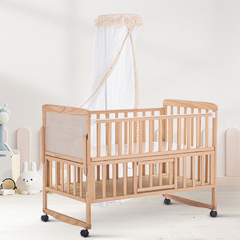 2-in-1 Solid Wood Crib with Guardrails Natural Mini Crib with Casters