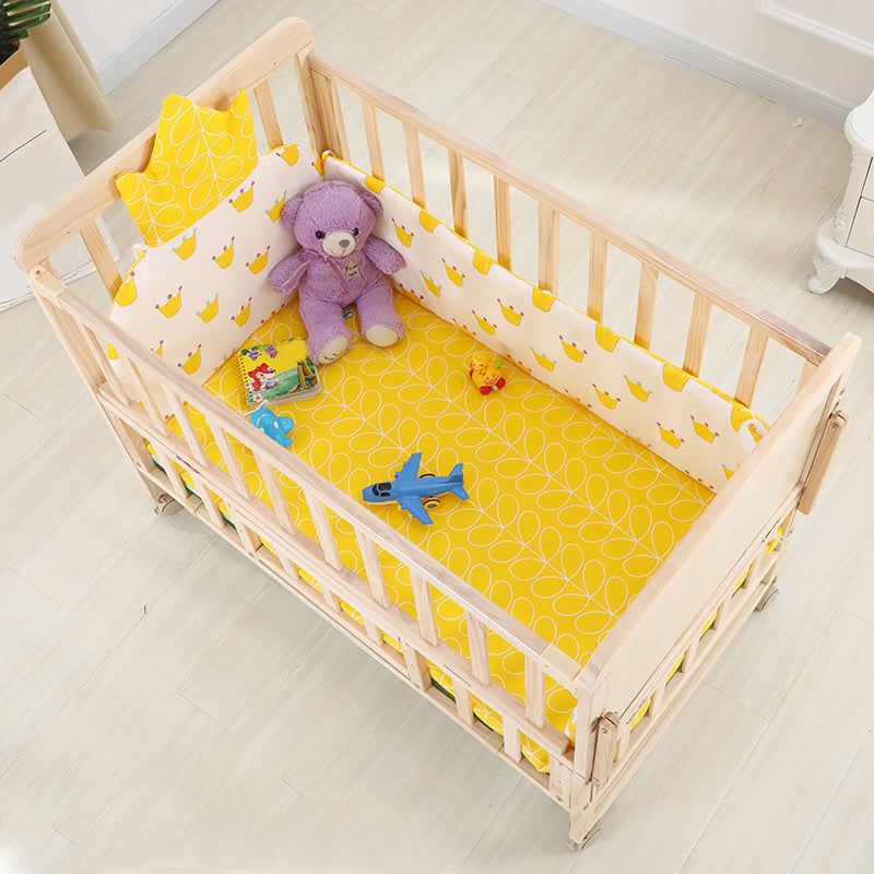 2-in-1 Solid Wood Crib with Guardrails Natural Mini Crib with Casters