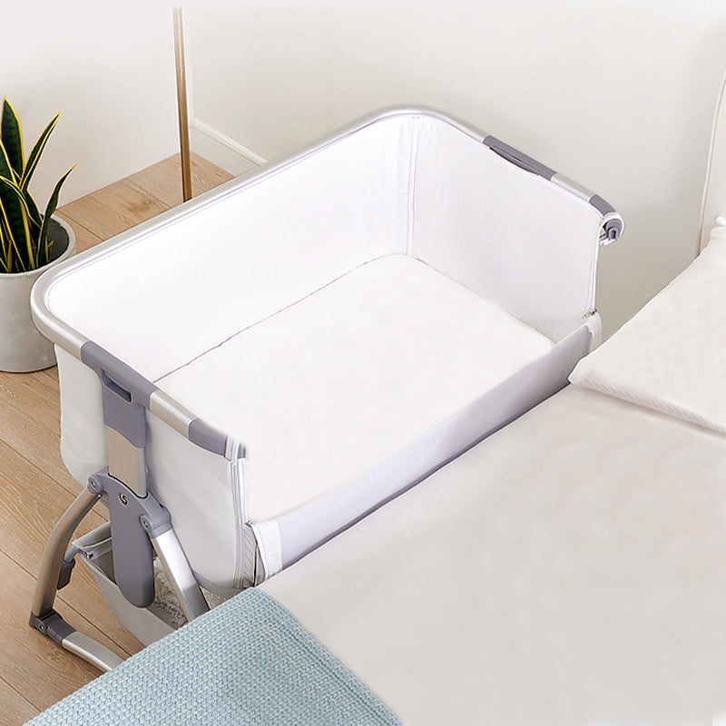 Gliding and Adjustable Metal Bassinet Oval Cradle with 4 Wheels and Storage Shelf