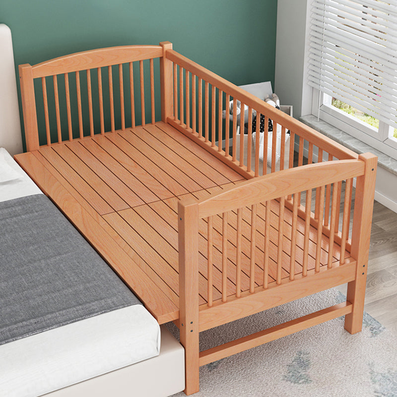 Functional Nursery Crib with Adjustable Height in Natural Wood