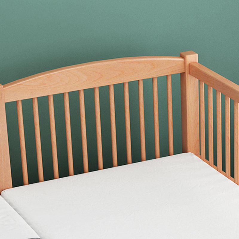 Functional Nursery Crib with Adjustable Height in Natural Wood