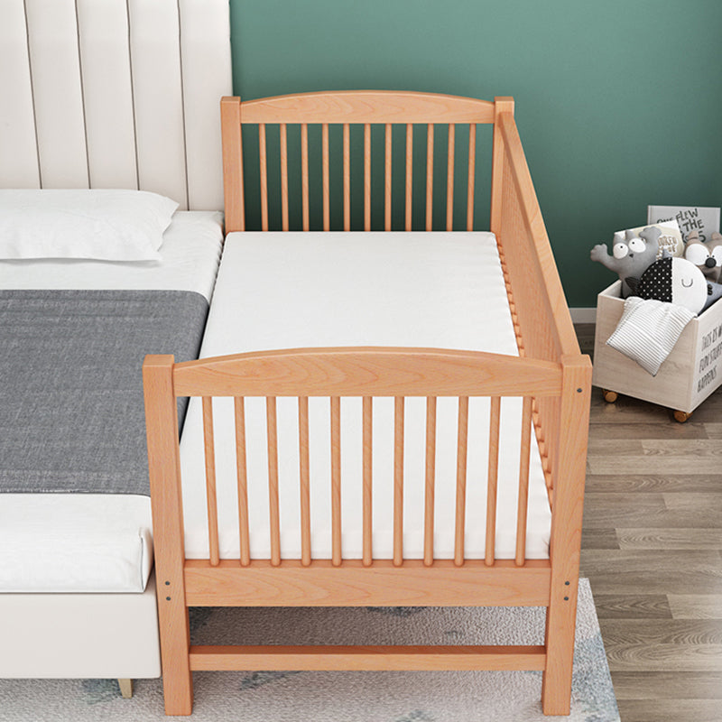 Functional Nursery Crib with Adjustable Height in Natural Wood