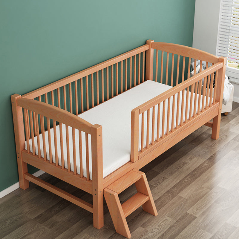 Functional Nursery Crib with Adjustable Height in Natural Wood