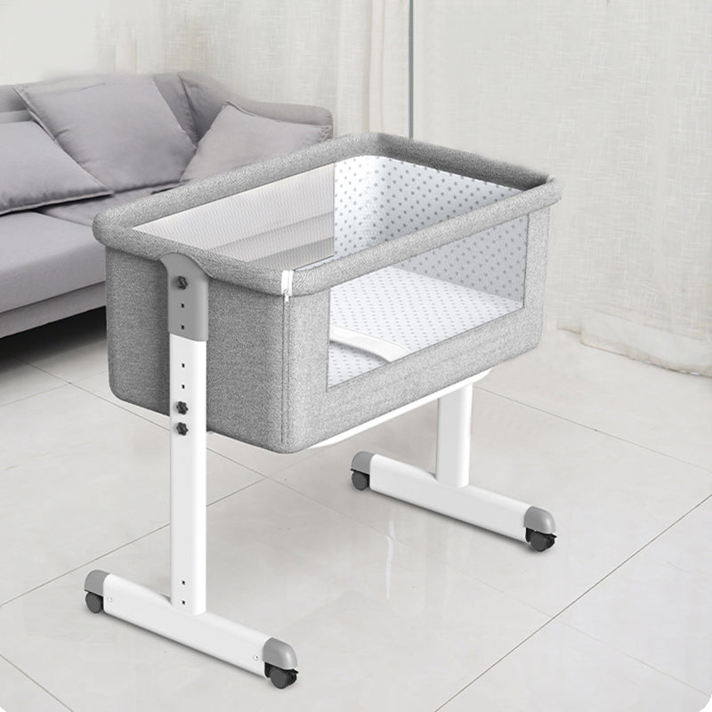 Contemporary Foldable Crib Cradle Metal Bedside Bassinet with 4 Wheels