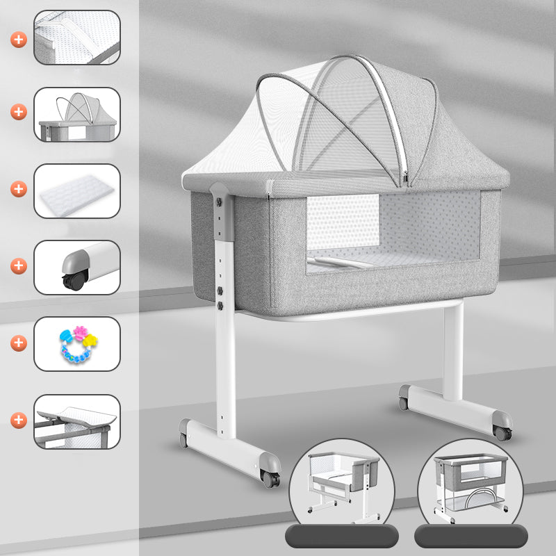 Contemporary Foldable Crib Cradle Metal Bedside Bassinet with 4 Wheels