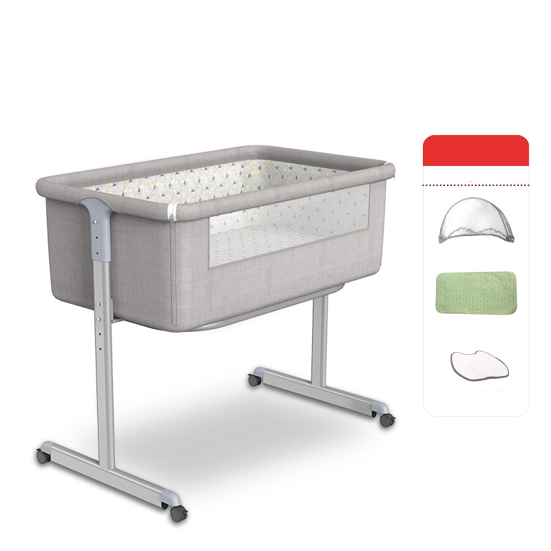 Contemporary Foldable Crib Cradle Metal Bedside Bassinet with 4 Wheels