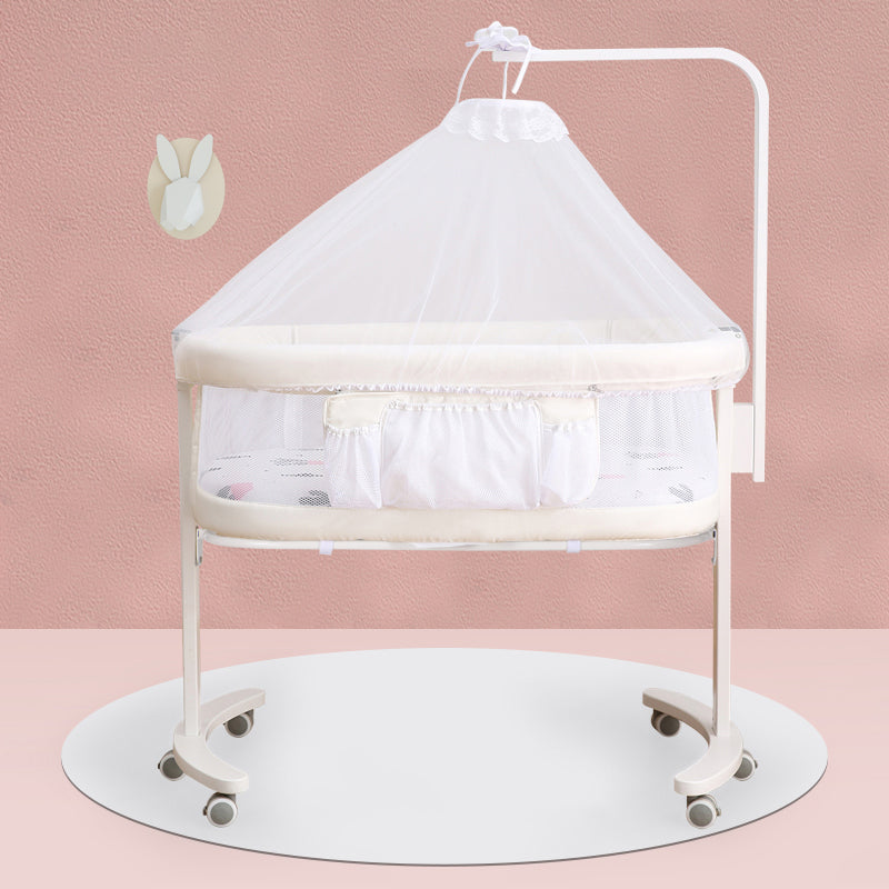 Modern Rocking Crib Cradle Metal Oval Bedside Bassinet with 4 Wheels