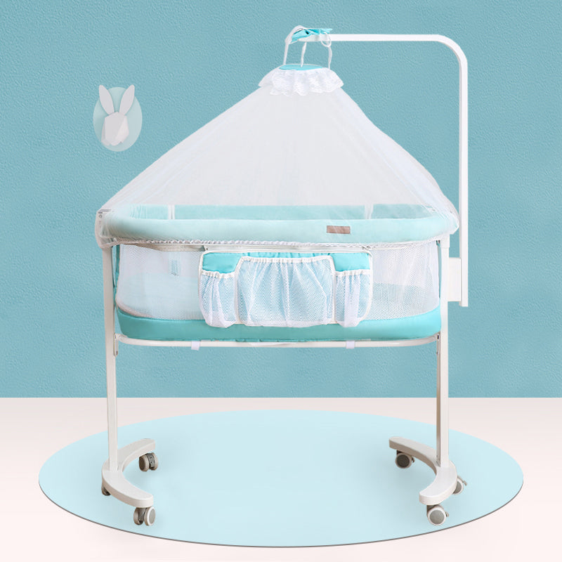 Modern Rocking Crib Cradle Metal Oval Bedside Bassinet with 4 Wheels