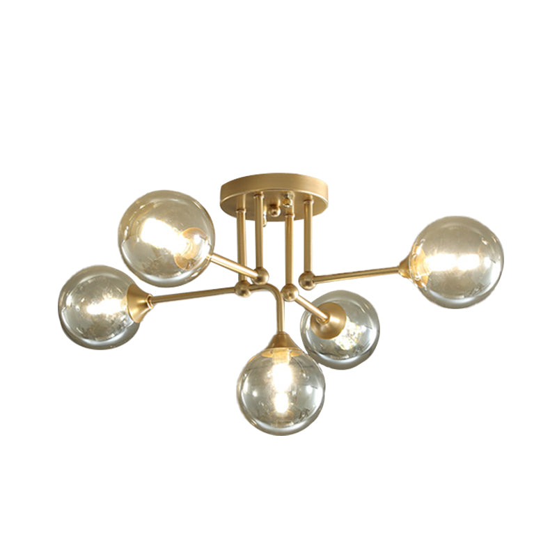 Moderne 5 lichten semi -flush verlichting goud/zwart en gouden bol plafondlamp met heldere glazen schaduw