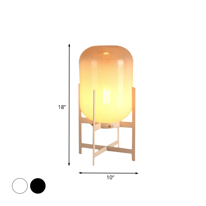 Minimalist Quadruped Night Light Metal 1-Head Living Room Table Lamp in White/Black with Oval Tan Glass Shade