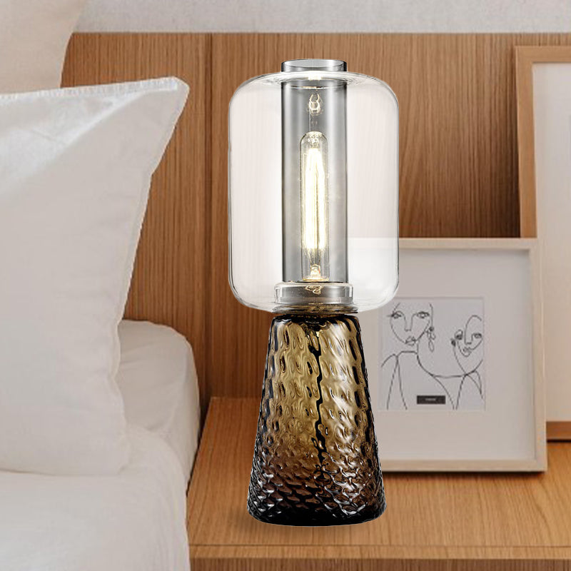 Trapezes Schlafzimmer Schreibtisch Hellem Rauch grau/Cognac Wasserglas 1-Licht postmoderne Plug-in-Tischlampe mit Zylinderschatten