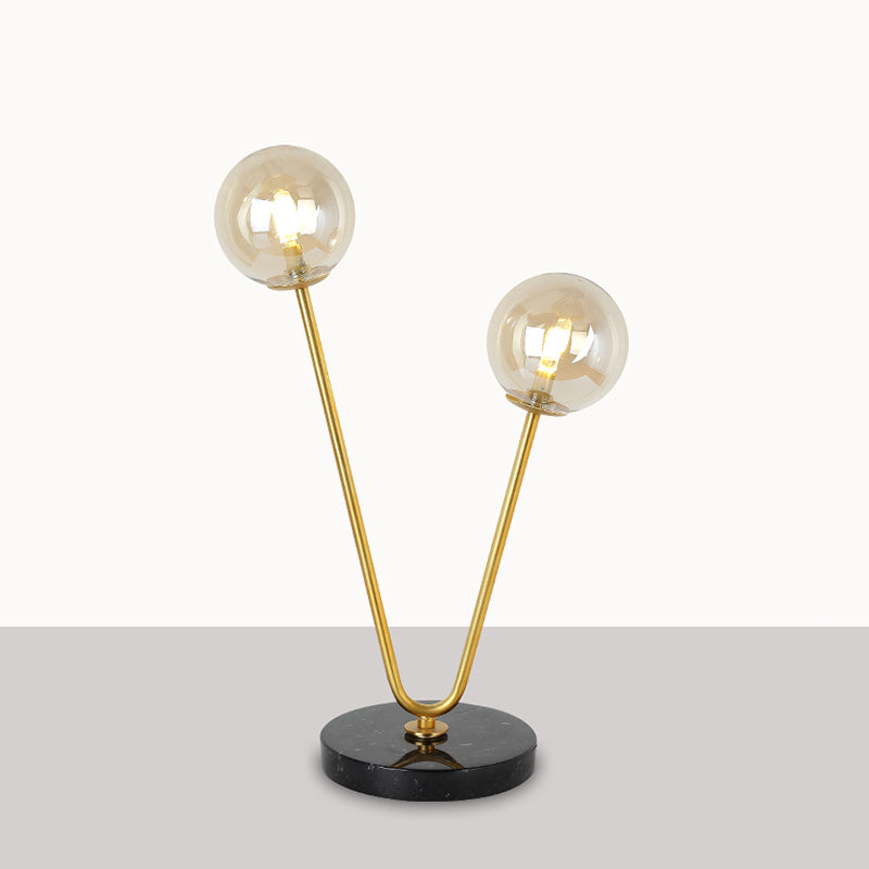 2 Bulbs Bedroom Table Light Post-Modern Black and Gold Night Lamp with Dual Ball Amber Glass Shade