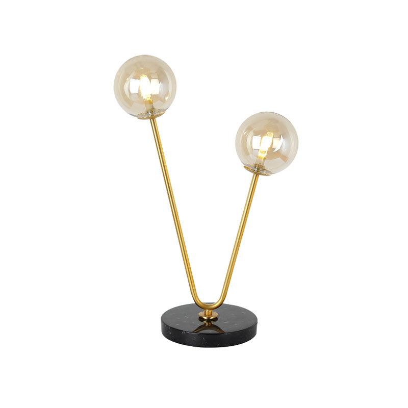 2 Bulbs Bedroom Table Light Post-Modern Black and Gold Night Lamp with Dual Ball Amber Glass Shade