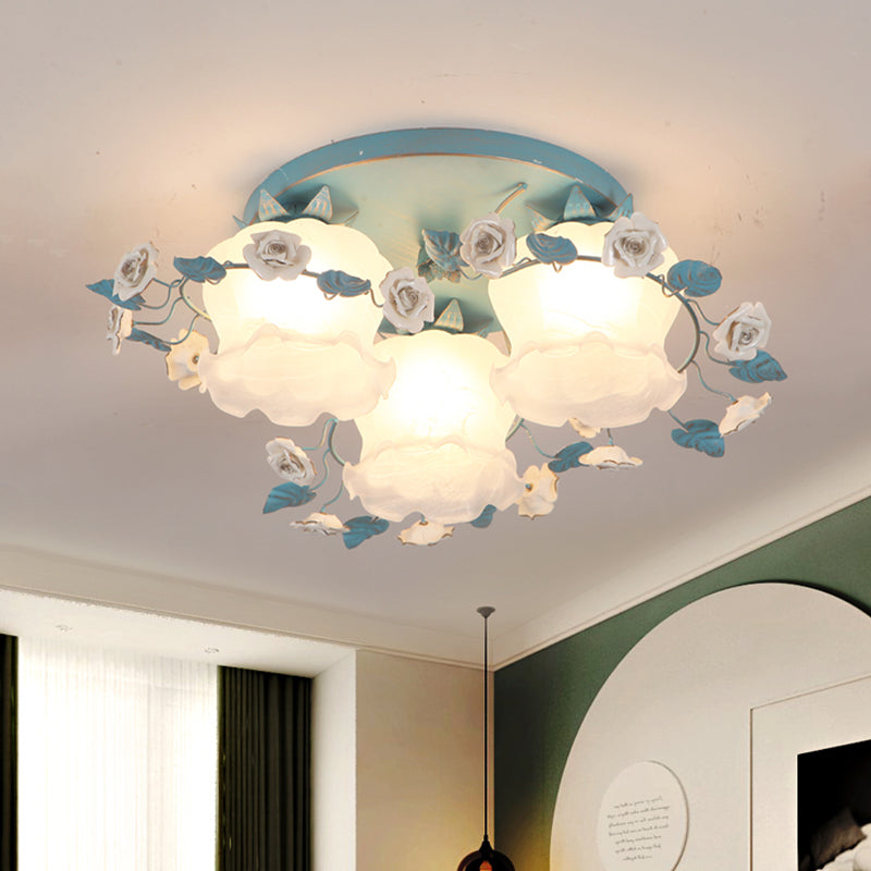 Pastoral Half-Open Flower Ceiling Lamp 3/5 Lights Frosted Glass Semi Mount Lighting with Rose Wreath in Pink/Blue