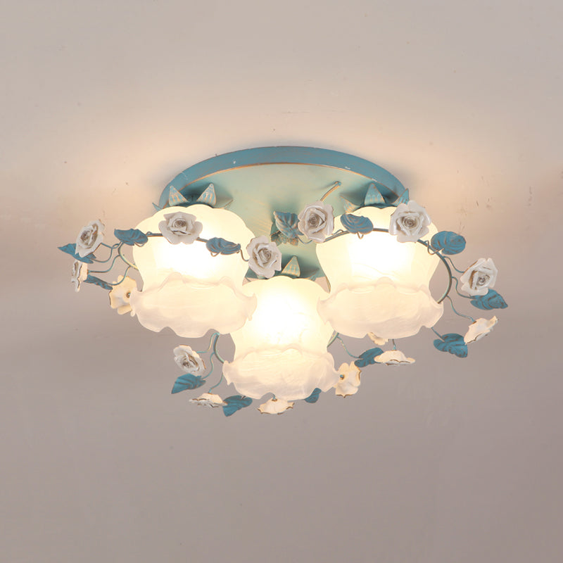 Pastoral Half-Open Flower Ceiling Lamp 3/5 Lights Frosted Glass Semi Mount Lighting with Rose Wreath in Pink/Blue